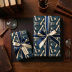 Navy blue graduation wrapping paper with vintage cap and diploma pattern, tied with a bow by Wrapped Studios.