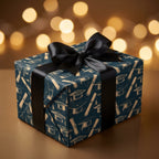 Navy and gold graduation wrapping paper with a black satin bow, luxury gift wrap by Wrapped Studios.