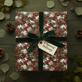 Luxury Christmas gift box wrapped in camouflage wrapping paper with green velvet ribbon.