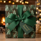 Rustic forest Christmas wrapping paper with a green ribbon and holiday gift tag by Wrapped Studios.
