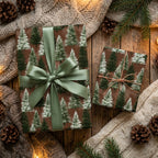 Rustic woodland pine tree Christmas gift wrap with a sage green ribbon, by Wrapped Studios.