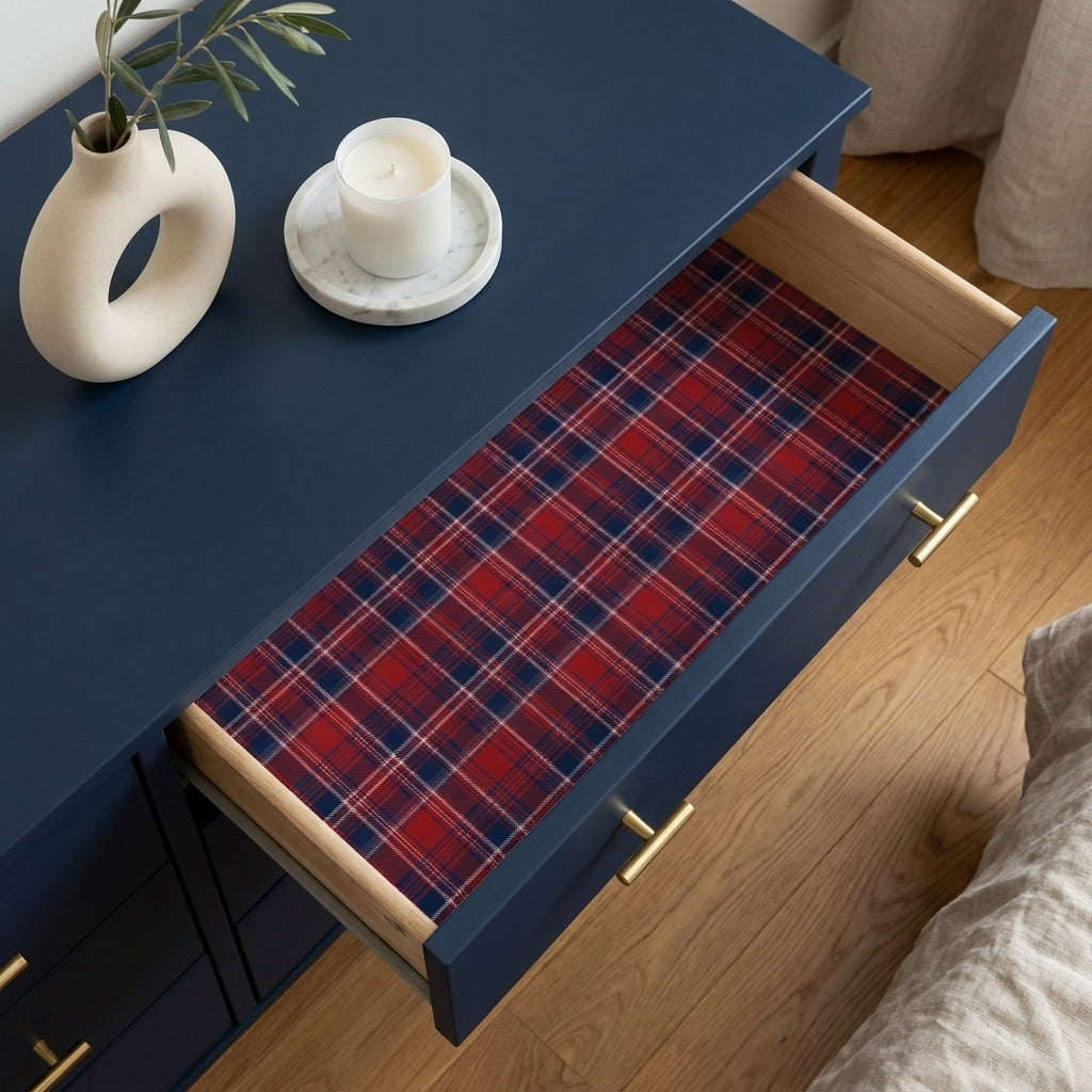 Red plaid Christmas wrapping paper by Wrapped Studios lining a blue dresser drawer.