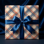 Luxury blue and orange plaid wrapping paper with a satin ribbon bow by Wrapped Studios.