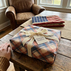 Patriotic red and blue rustic plaid wrapping paper with cream velvet ribbon by Wrapped Studios.