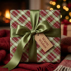 Red and green plaid Christmas wrapping paper with a green satin bow and gift tag by Wrapped Studios.