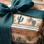 Rustic desert cactus wrapping paper with a frayed teal ribbon by Wrapped Studios.