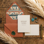 Desert wedding invitation with terracotta envelope, cactus liner, and pampas grass by Wrapped Studios.