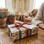 Rustic cactus wrapping paper in a southwest design with a red raffia bow, by Wrapped Studios.