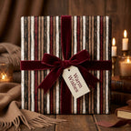Rustic striped Christmas wrapping paper with a burgundy velvet bow by Wrapped Studios.