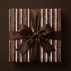 Rustic striped wrapping paper with a luxury brown satin bow on a square gift box by Wrapped Studios.