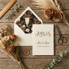 Rustic western wedding invitation with bull skull liner and dried roses by Wrapped Studios.
