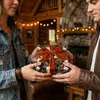 Couple exchanging gift in rustic floral and skull wrapping paper with velvet bow by Wrapped Studios.