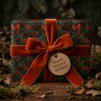Rustic Christmas gift wrap with winter pinecone pattern and a burnt orange velvet ribbon by Wrapped Studios.