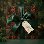 Luxury Christmas wrapping paper with botanical pinecone print and green satin bow by Wrapped Studios.