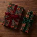 Luxury woodland Christmas gift wrap by Wrapped Studios, featuring pinecone botanical paper and velvet bows.
