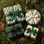 Luxury forest green botanical wrapping paper and elegant gift bows by Wrapped Studios.