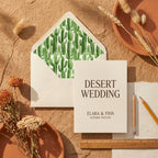 Boho desert wedding invitation with watercolor cactus envelope liner by Wrapped Studios.