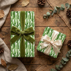 Cactus wrapping paper with green velvet and cream satin bows on rustic wood, by Wrapped Studios.
