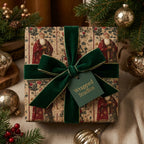 Wrapped Studios Christmas gift; vintage-style wrapping paper with a Santa pattern and green velvet ribbon.