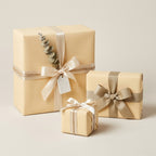 Elegant gift wrapping with neutral paper, satin ribbons and decorative tag for birthday, wedding or baby shower present.