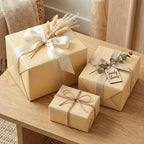 Tan wrapping paper on gifts with neutral ribbons and twine; elegant solid color wrap for birthdays or weddings.