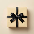 Beige wrapping paper with elegant black satin ribbon bow for birthday, Christmas, or wedding gifts.