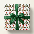 Funny frog Christmas gift wrap with Santa hats and a green satin bow by Wrapped Studios.
