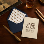 Vintage jazz wedding invitation with saxophone patterned envelope liner by Wrapped Studios.