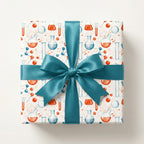 Science wrapping paper with chemistry beakers and a teal satin ribbon bow, by Wrapped Studios.