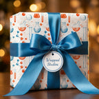 Chemistry science wrapping paper with blue satin ribbon and gift tag by Wrapped Studios.