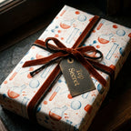 Chemistry wrapping paper with test tubes and flasks, rust velvet bow, and Top Secret tag by Wrapped Studios.