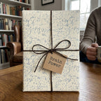 Nerdy math equations wrapping paper with a twine bow and gift tag by Wrapped Studios.