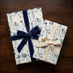 Vintage medical wrapping paper with science illustrations and velvet bow by Wrapped Studios.
