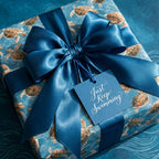 Luxury sea turtle wrapping paper with a large blue satin bow and gift tag by Wrapped Studios.