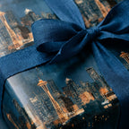 Seattle city skyline wrapping paper in navy blue with a matching linen bow by Wrapped Studios.