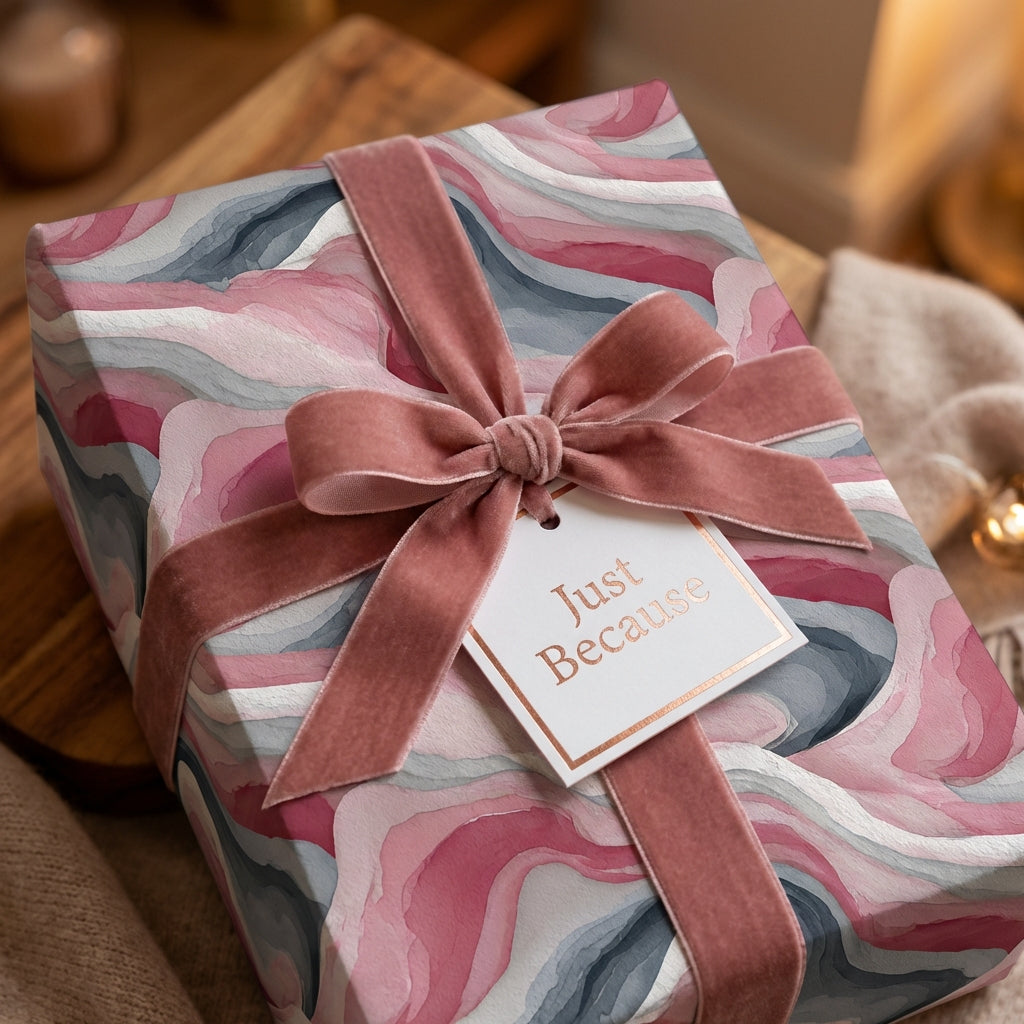 Abstract pink and gray luxury gift wrap with a velvet rose ribbon and "Just Because" tag.