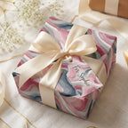 Modern pink and gray marble wrapping paper with cream ribbon and "For Sophie" gift tag.