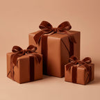 Elegant brown wrapping paper for gifts, featuring velvet ribbons and bows on square boxes.