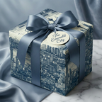 Elegant gift box wrapped in blue cityscape wrapping paper with matching ribbon.