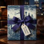 Elegant Seattle skyline wrapping paper with a navy ribbon bow on a square gift box.