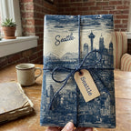 Seattle themed wrapping paper with a navy blue skyline design and twine bow.