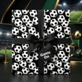 Soccer wrapping paper on a gift box with a black ribbon bow and tag by Wrapped Studios.
