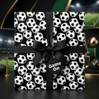 Soccer wrapping paper on a gift box with a black ribbon bow and tag by Wrapped Studios.
