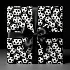Soccer wrapping paper with a black satin bow on a gift box, sports birthday gift wrap by Wrapped Studios.
