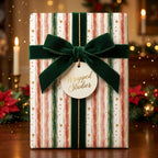 Striped Christmas wrapping paper with gold dots, velvet ribbon, and Wrapped Studios tag.