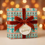 Teal and terracotta Southwest cactus birthday wrapping paper with rust velvet bow by Wrapped Studios.