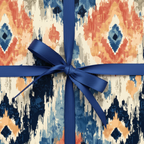 Abstract ikat pattern wrapping paper with dominant navy blue, coral, and cream tones, tied with a classic navy satin ribbon and bow.