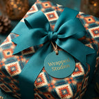 Southwest boho wrapping paper in teal and terracotta with a ribbon bow, by Wrapped Studios.