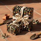 Gifts wrapped in fun cactus pattern wrapping paper, tied with rustic string and ribbon.