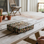 Gift wrapped in botanical wrapping paper with a cactus pattern and tied with rustic twine.